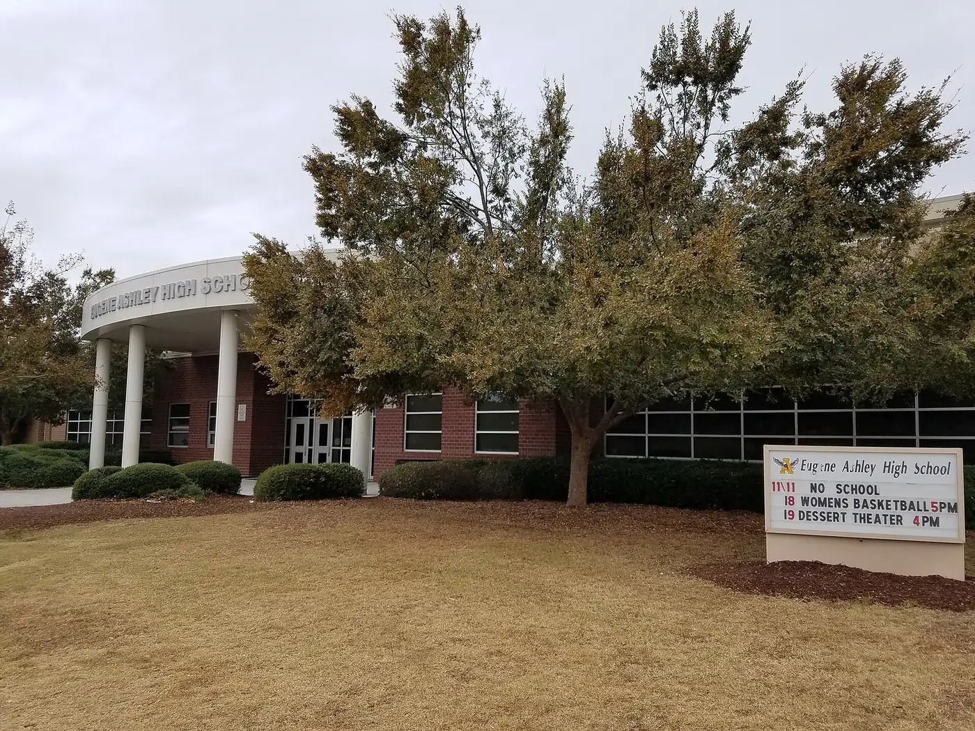 The columned main entrance and sign of Eugene Ashley High School on Halyburton Memorial Parkway, south of Wilmington