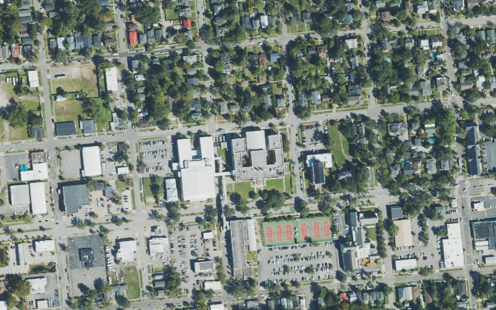 New Hanover High School's buildings on Market Street in Wilmington, seen from the air, with its tennis courts and parking lots to the south