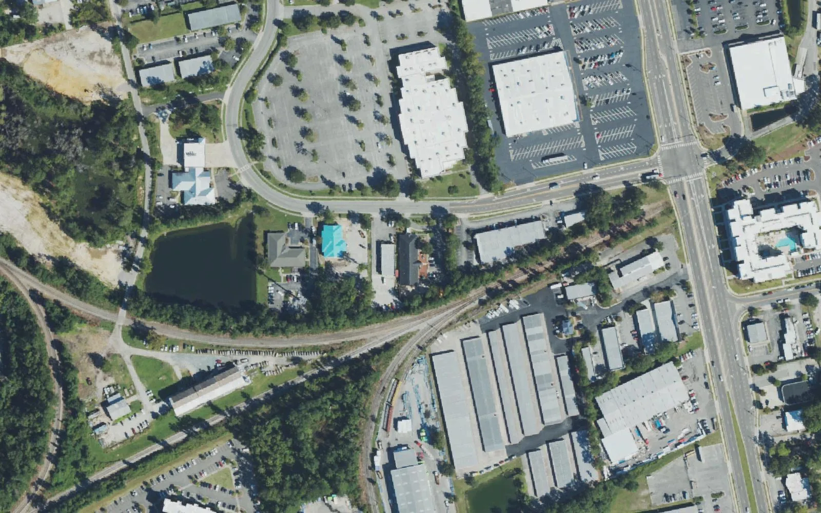 Buildings, a pond and rail lines around Cinema Drive in Wilmington, where Wilmington Preparatory Academy is based, seen from the air