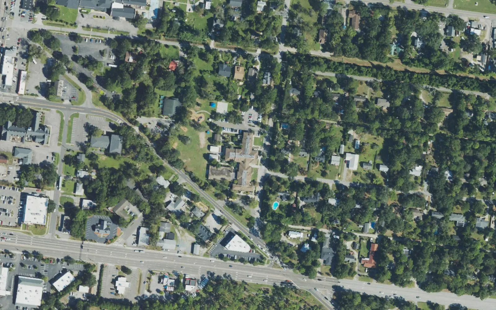 Winter Park Elementary School among the tree-lined streets of Wilmington's Winter Park neighborhood off MacMillan Avenue, seen from the air